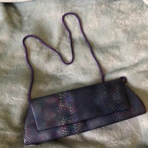 Iridescent snakeskin clutch